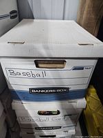 Closed banker's box labeled 'Baseball' and 'Baseball Cards'