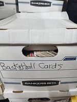 Closed Banker’s Box labeled 'Basketball Cards' containing three layers of cards.