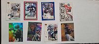 Front view of 8 football trading cards showing player images, designs, and team jerseys.
