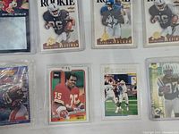 Front view of football cards featuring Napoleon Kaufman, Rashaan Salaam, and others