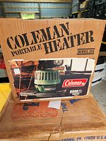Original cardboard box showing Coleman Portable Heater Model 515 with 8000 BTU output, vintage branding and graphics.