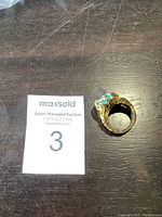 Top view of ring on table next to lot marker