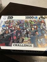 Front of box showing completed puzzle artwork with Mandalorian characters and logos