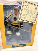 Front view of Bobby Orr hockey figure inside original Starting Lineup box with Letter of Authenticity visible inside.