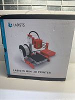 Box front showing Labists Mini 3D Printer branded packaging