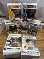 Overview of all seven Funko Pops showing characters, packaging condition
