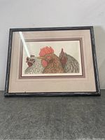 Full view of framed barnyard trilogy print showing three chickens with dark wood frame and triple mat.