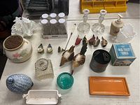 Overview photo of all items including candle holders, birds, jars, trays and containers.