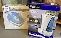 Box of Holmes Ultrasonic Humidifier showing model intended for medium rooms with filter-free operation