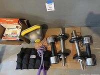 Overview of all workout items including kettlebell, dumbbells, jump rope, weighted vest, and fitness DVDs.