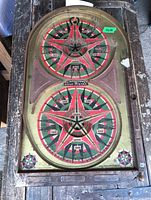 Full view of the Lindstroms Gold Star pinball marble game board showing both circular star target areas.