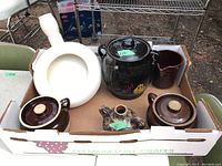 Group photo of all pottery items in box showing bean pots, bedpan, vase, crock/cookie jar, and pitcher