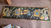 Full view of the hand painted Indian tapestry showing elephants and figures in bright colors on dark background.