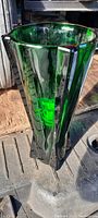 View of hexagonal fluted green glass vase showing thick glass and Art Deco angular design