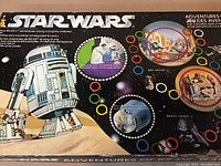 Close-up photo of the game box top showing the Star Wars Adventures of R2-D2 title with game path and character artwork.