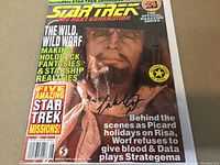 Front cover of Star Trek The Next Generation magazine featuring Worf, with autograph of Michael Dorn across cover.