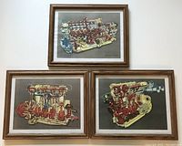 Three framed vintage engine lithographs arranged on a white wall, showing detailed coloured cutaway engine designs.