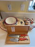 Heritage Mint ceramic dishes including large platter, nested bowls, sugar bowl, creamer, and small teapot with fruit and grape motif
