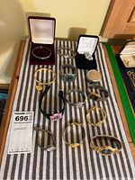 Overview of all watches and bangles on striped cloth