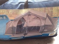 Photo of tent carrying bag with printed images showing the Glacier Lake Cabin tent setup, highlighting large cabin design for 8 people.