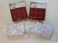 Five crib sheets displayed showing pattern and packaging details.