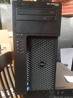 Front view of Dell Precision T1650 computer tower showing USB ports, optical drive, and Dell logo on vented panel.