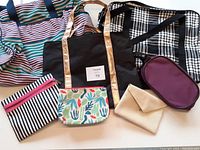 Photo showing full set of assorted bags including weekender bags, totes, toiletry bags, and pouch