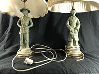 Photo of both Chinese figure lamps side by side showing wiring condition and bases.
