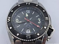 Front close-up photo of the ESQ watch dial with compass bezel and date window.