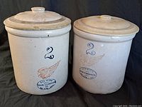 Pair of 2-gallon Red Wing crocks with lids, showing general view.