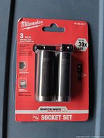 Packaged 3 piece Milwaukee Shockwave 3/8 inch thin wall deep impact socket set, showing the product and packaging front.