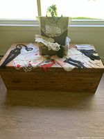 Overview of Durabuilt train case with displayed accessories including headpiece, gloves, kerchiefs, and macrame necklaces