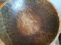 Top view of the wooden bowl showing the birdseye maple grain pattern and wear.