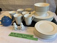 Full set showing six white plates, six bowls, six mugs, blue teapot and Royal Albert salt and pepper.