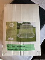 Box packaging showing image of umbrella mosquito net and lot label
