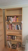Full view of the Ikea Billy bookcase with books on shelves to show size and use, though contents not included in sale.