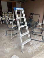 Full front view of the 5-step aluminum ladder, showing construction and step detail