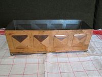 Front view of the copper planter showing rectangular shape and four embossed triangular patterns.