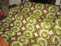 Folded drapery panels laid out to show overall pattern, colors and fabric quantity