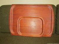 Both teak trays stacked, showing size difference and wood finish.