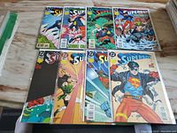 Group photo showing all 8 Superboy comic books from issues #10 to #17 laid out on a surface in protective sleeves.