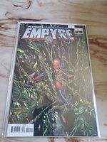 Front cover photo showing the full comic book cover featuring Spider-Man among green vines, with the Empyre title and Marvel branding.