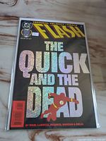 Full cover shot of The Flash comic titled The Quick and The Dead, showing holographic text and the DC 100 Centennial Edition logo.