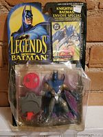 Front view of Legends of Batman Knightsend Batman action figure in original blister packaging, showing figure, accessories, and collector card.