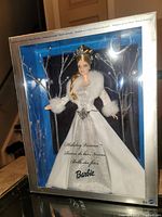 Front view of Holiday Visions Barbie doll in original box showing full gown and coat.