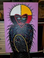 Front view of original acrylic painting by Anthony Jones depicting stylized figures with symbolic colors and patterns.