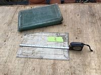 Stack of clear beveled edge glass plates showing rectangular shape and minor wear.