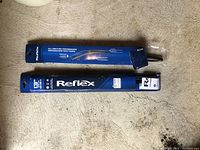 Two Reflex 13 inch wiper blades in blue packaging showing brand and size