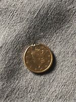 Obverse of gold coin showing Liberty head and solder loop at top