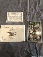 Image shows the dime set packaging including certificate and envelope from The American Historic Society alongside the protective case containing the four dimes.